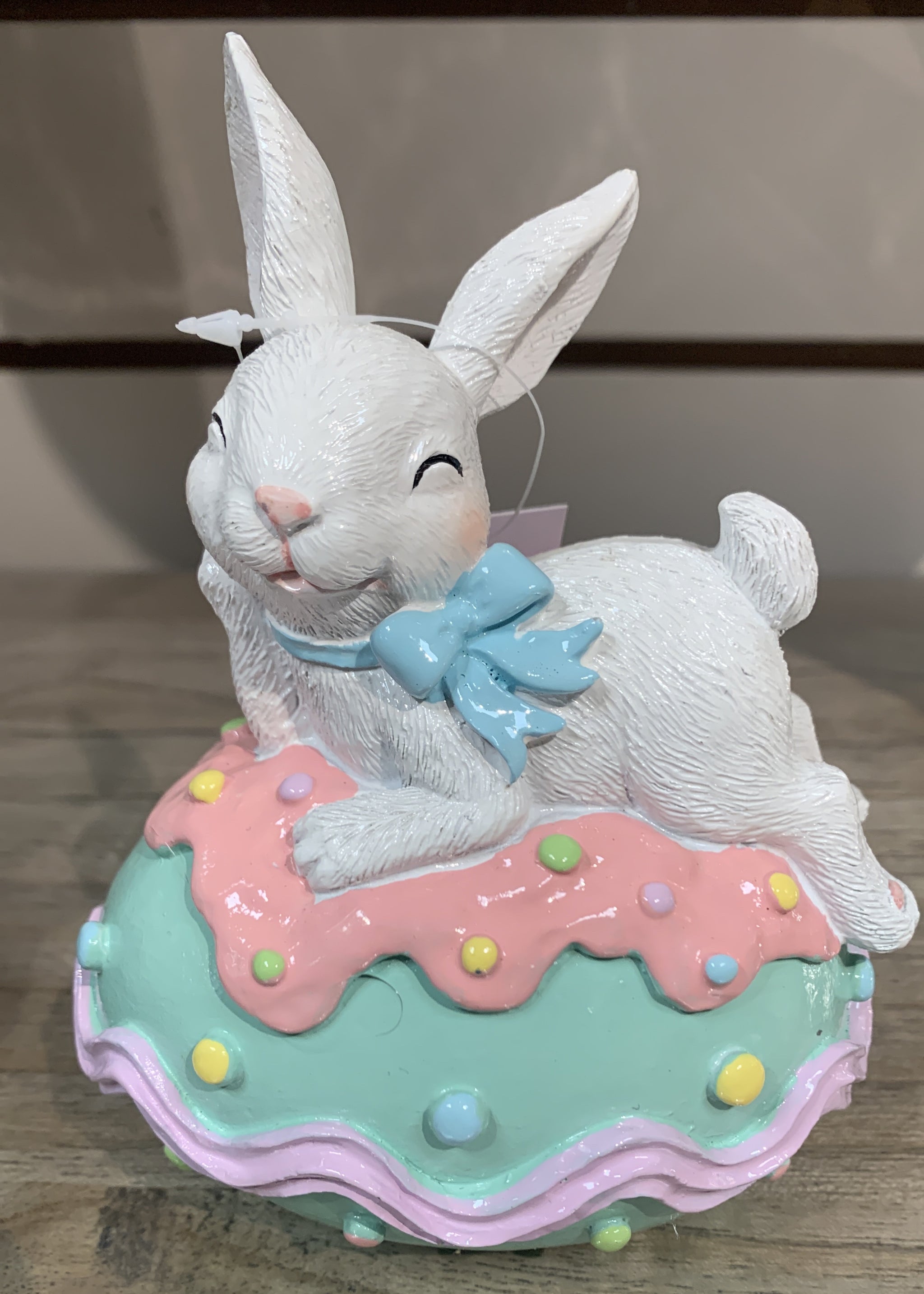 Rabbit Resting on Green Egg